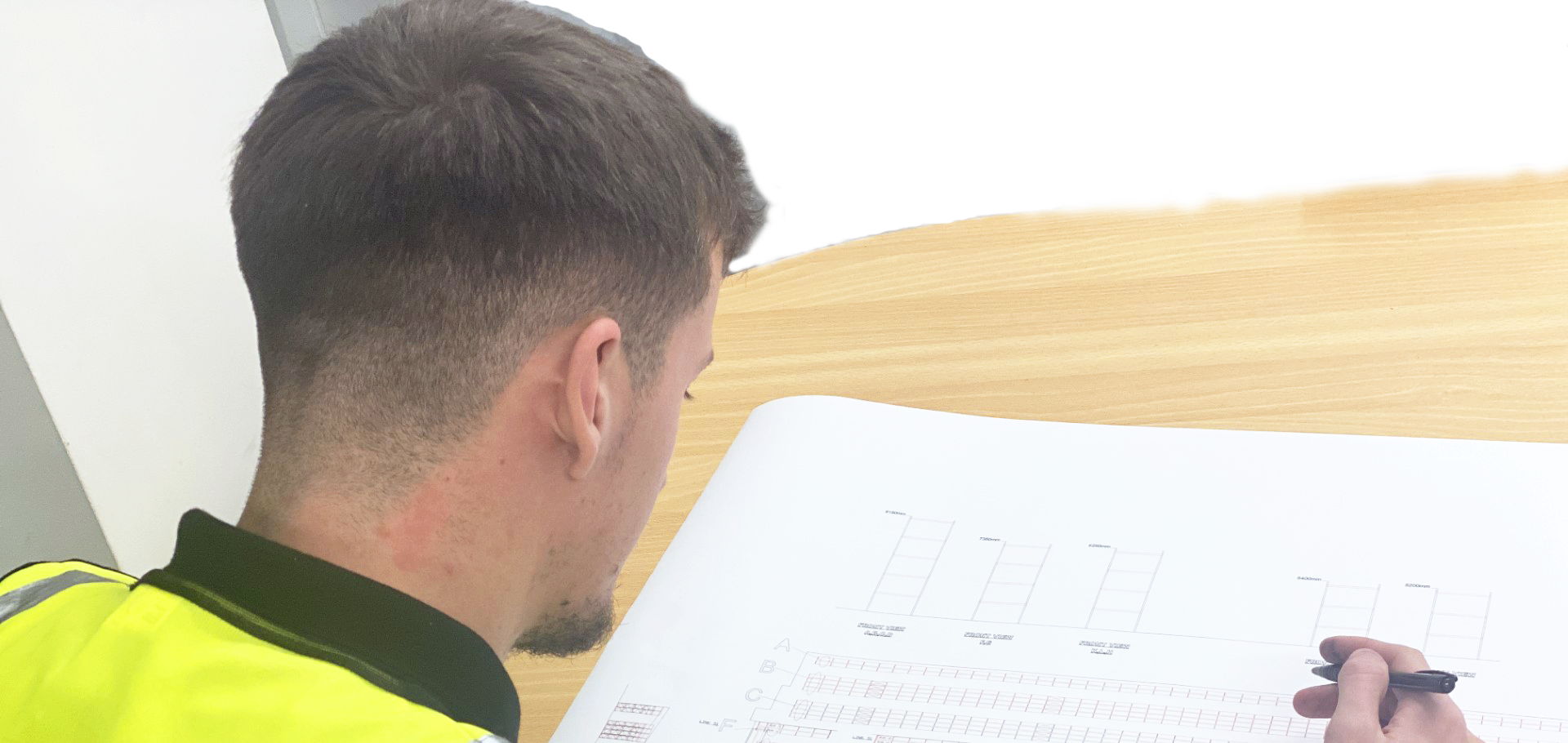 Employee inspecting pallet racking